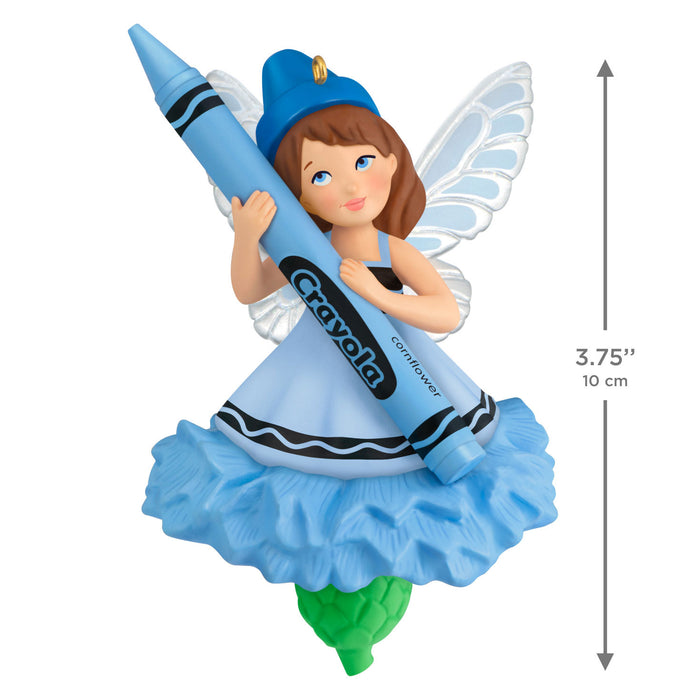 Fairy figurine holding a blue crayon with Crayola branding, on a white background.
