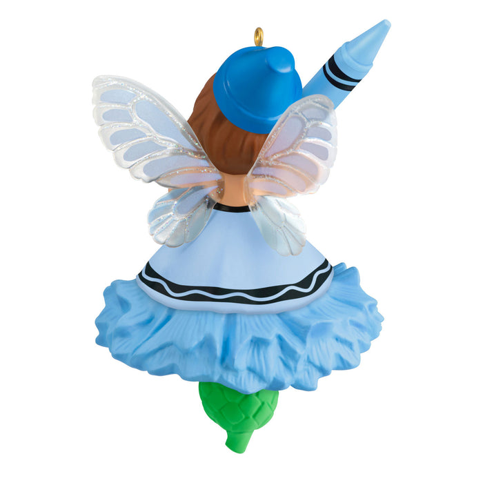 Decorative fairy figurine with blue dress and hat on a white background