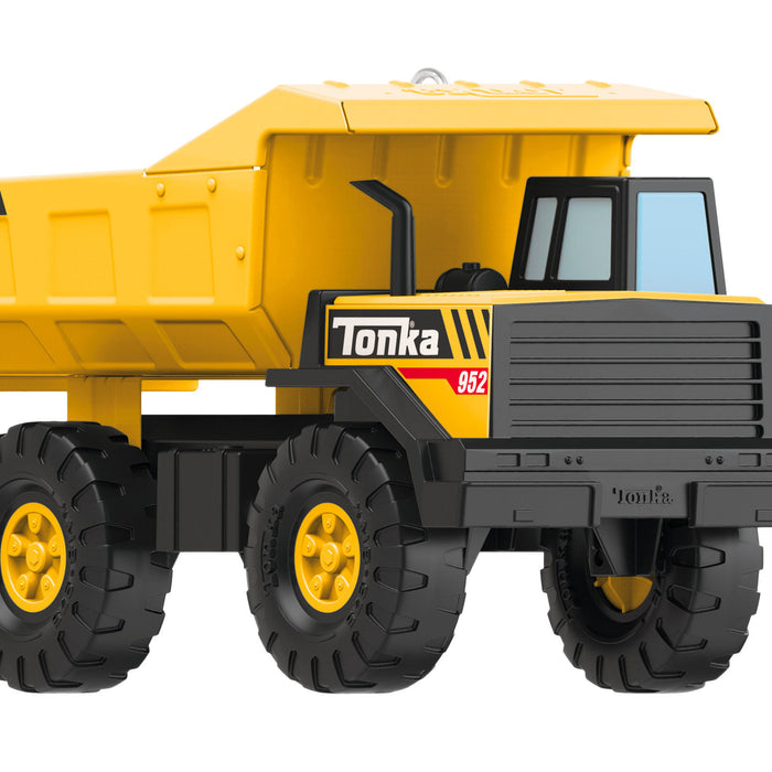 Yellow and black toy dump truck with 'Tonka' branding on a white background