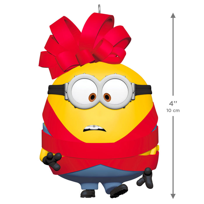Minion character with a red bow, size indicated as 4" or 10 cm, on a white background