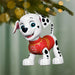 Christmas ornament of a dalmatian dog in a red sweater hanging on a tree.