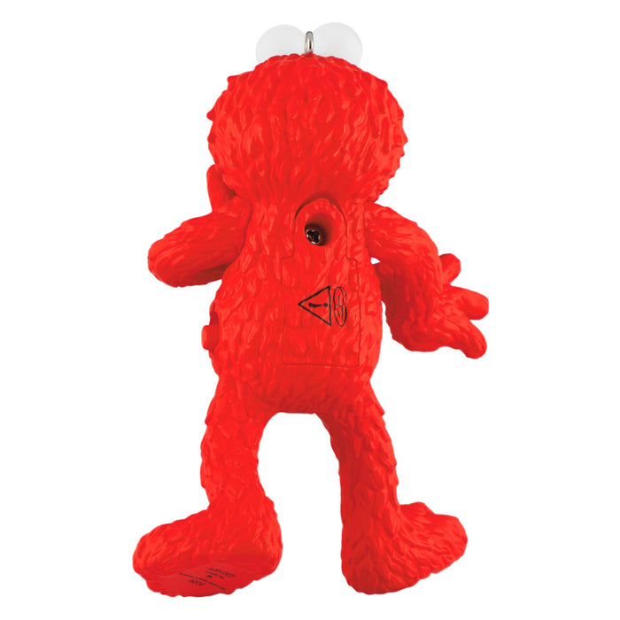 Red plush toy with a triangular logo on a white background