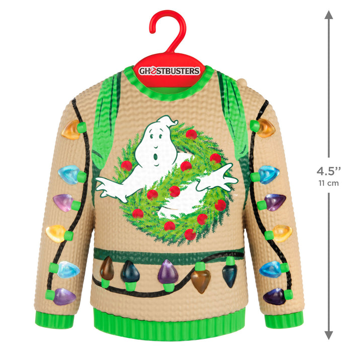 Ghostbusters-themed Christmas sweater with ghost and wreath design on a hanger, featuring size measurement.