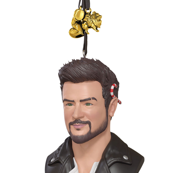 Figurine head with leather jacket and decorative item on a white background