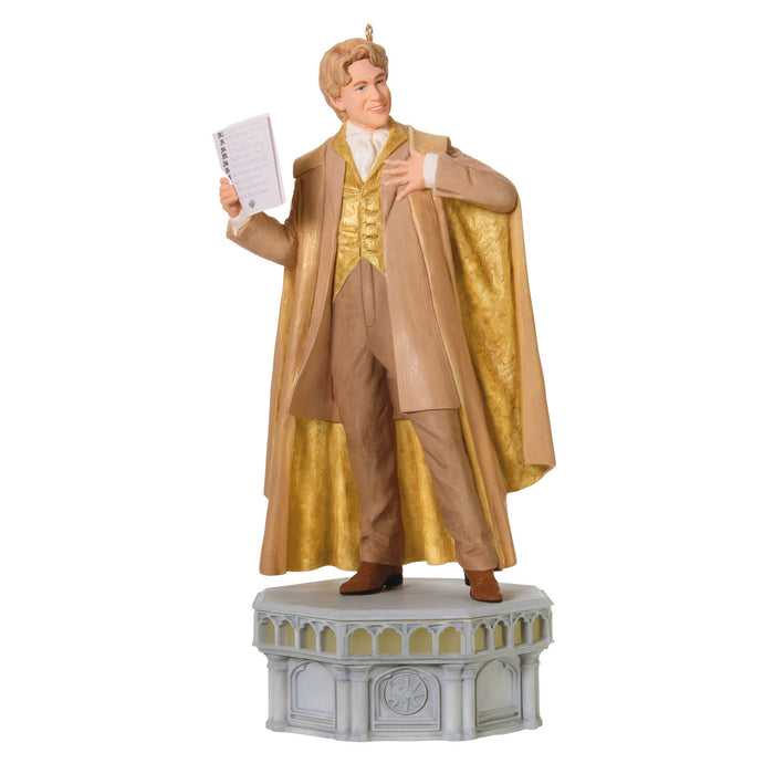 Statue of a person in formal attire with a cape holding a piece of paper on a white background