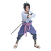 Anime character figurine in a dynamic pose with a sword on a white background