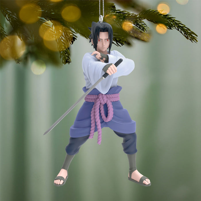 Character figurine with a sword, hanging from a Christmas tree branch.