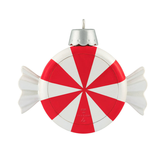 Red and white candy-striped Christmas ornament on a white background