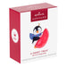 Hallmark Keepsake Christmas ornament packaging with a penguin design on a white background
