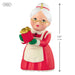 Miniature figurine of a character in a red dress holding a gift, with a measurement label on a white background.
