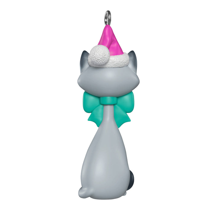 Cat-shaped ornament with a pink hat and green bow tie on a white background