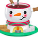 Snowman-themed hot chocolate mug with a carrot nose and candy cane scarf, filled with hot chocolate.