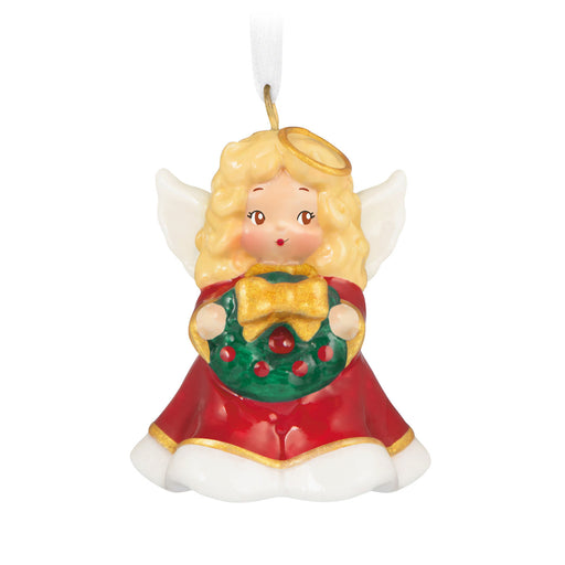 Christmas angel ornament with a wreath on a white background