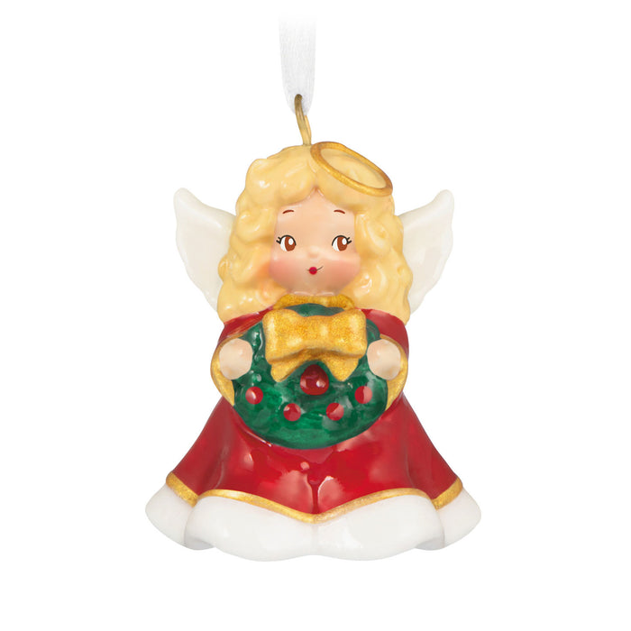 Christmas angel ornament with a wreath on a white background