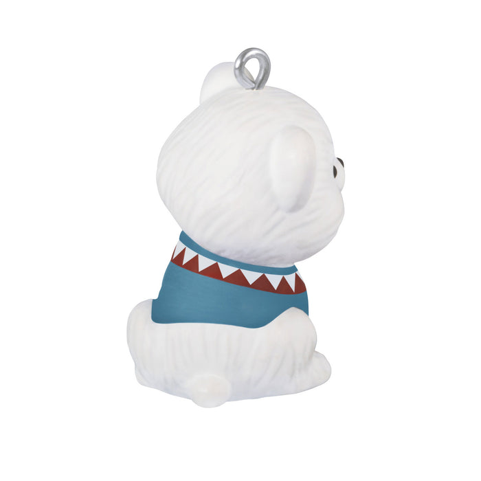 White plush toy with a blue shirt and shark mouth design on a white background