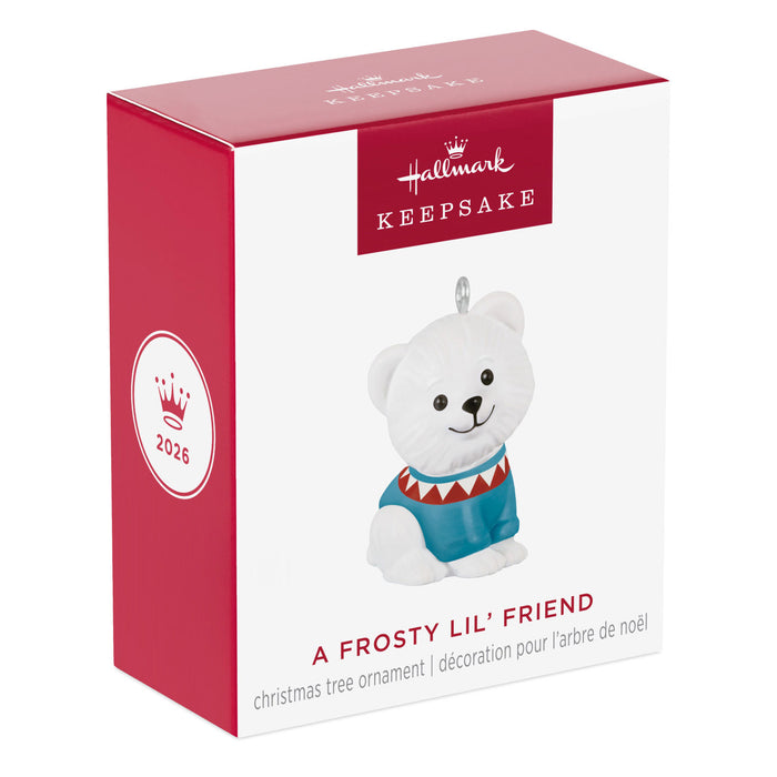 Hallmark Keepsake Christmas ornament packaging with a white bear in a blue sweater on a white background.