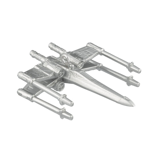 Metallic model of a spaceship on a white background