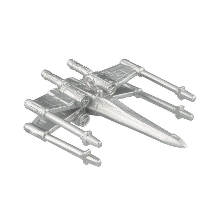 Metallic model of a spaceship on a white background
