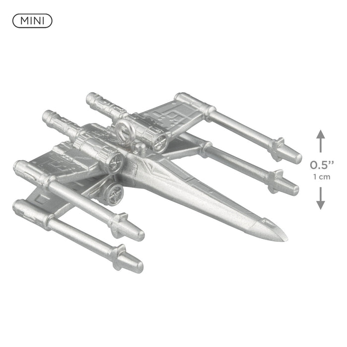Metal model of a spaceship with scale indicators on a white background