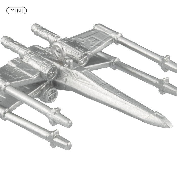 Metal model of a spacecraft with a 'MINI' label on a white background