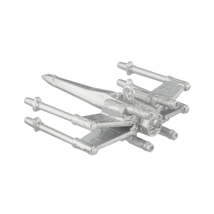 Metallic model of a spaceship on a white background
