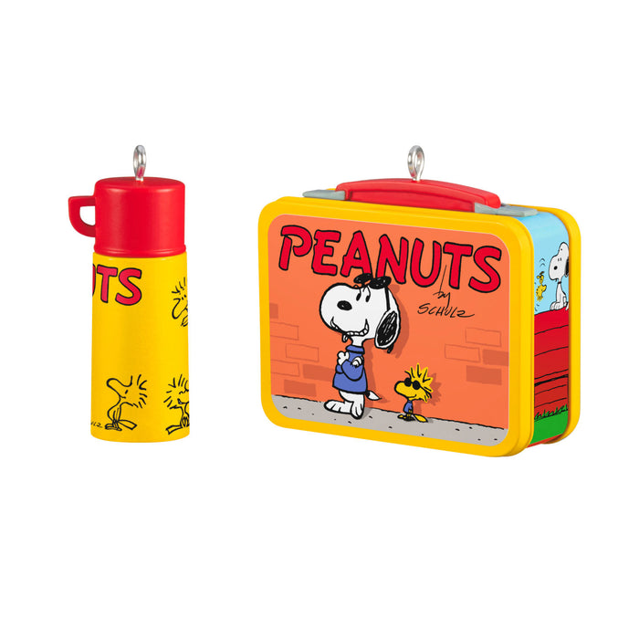 Peanuts-themed lunch box and thermos on a white background