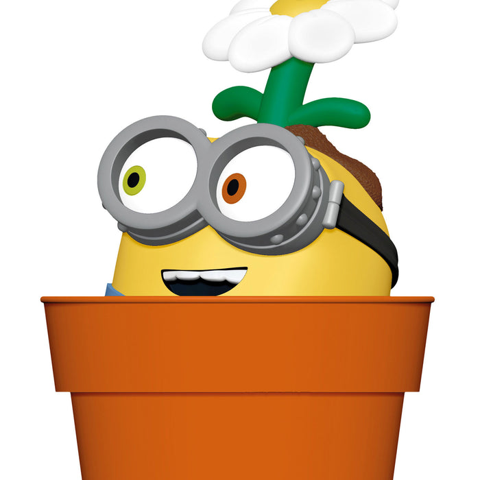 Cartoon character with a flower on its head peeking out of an orange pot