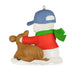 Decorative ornament of a snowman with a calf wearing a blue cap and red sweater, on a white background.