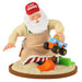 Figurine of Santa Claus in an apron and red cap with a toy truck, on a white background