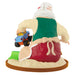 Figurine of a character with a large red sack, driving a toy car, on a white background