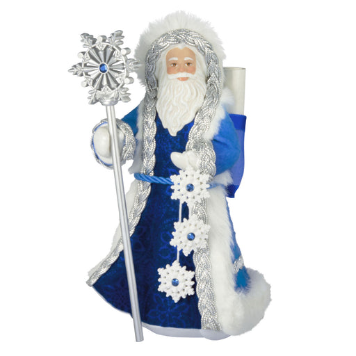 Decorative figure of a bearded man in a blue robe with silver and white accents on a white background