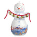 Decorative snowman ornament with jingle bells and a Santa Claus scene on a white background