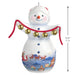 Decorative snowman ornament with bells and Santa Claus scene, featuring dimensions on a white background.