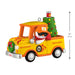 Christmas ornament of a yellow truck with a snowman driver and Christmas tree on a white background