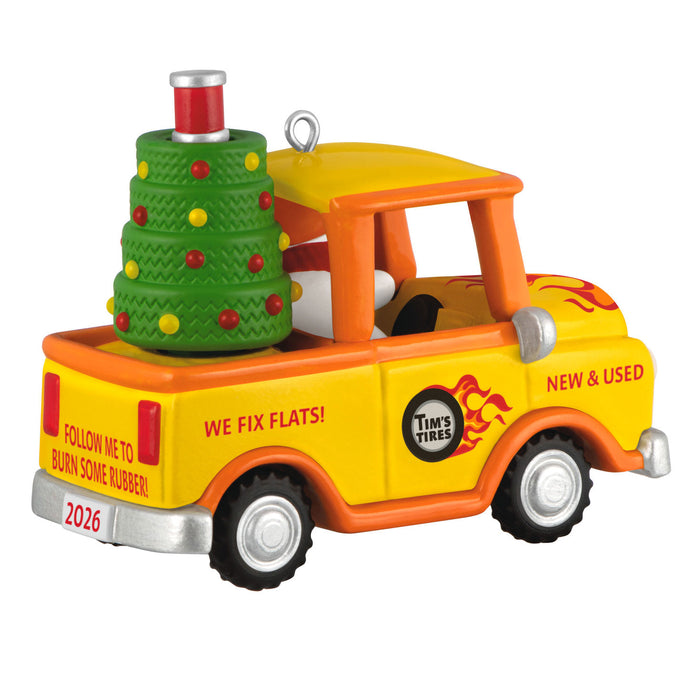 Toy truck with Christmas tree on a white background