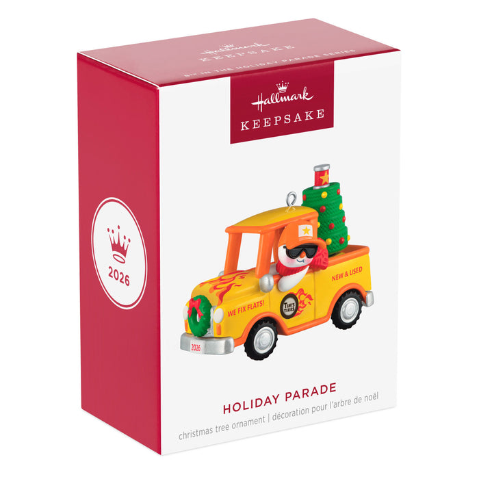 Hallmark Keepsake Christmas ornament packaging with a toy truck and penguin design.