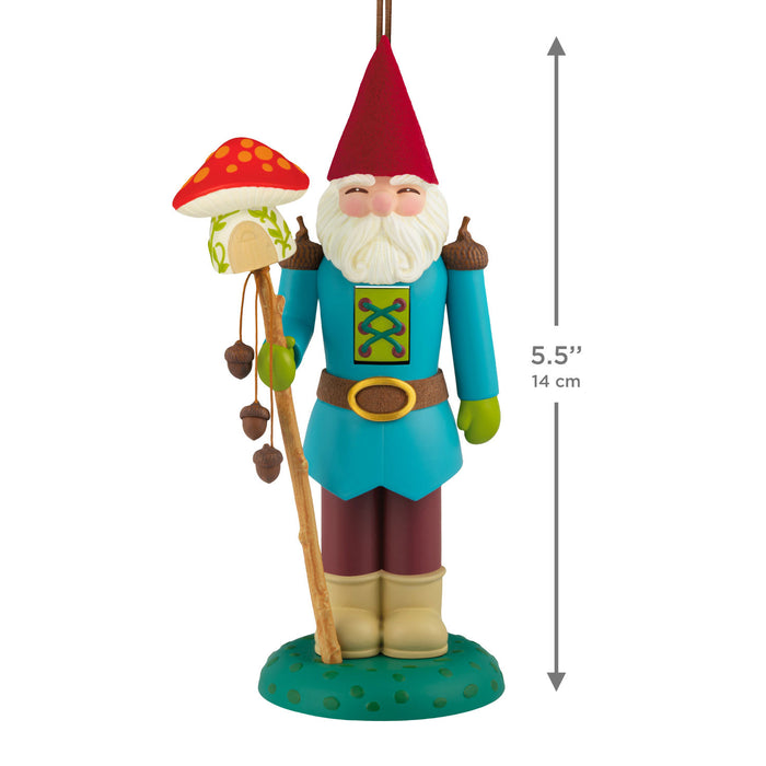Colorful gnome figurine with a mushroom staff and measurement details on a white background