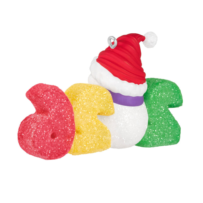 Colorful letter-shaped bath toys with a Santa hat on a white background