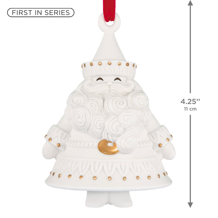 White decorative bell shaped like a Santa Claus figure with gold accents, first in series, on a white background.