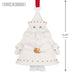 White decorative bell shaped like a Santa Claus figure with gold accents, first in series, on a white background.