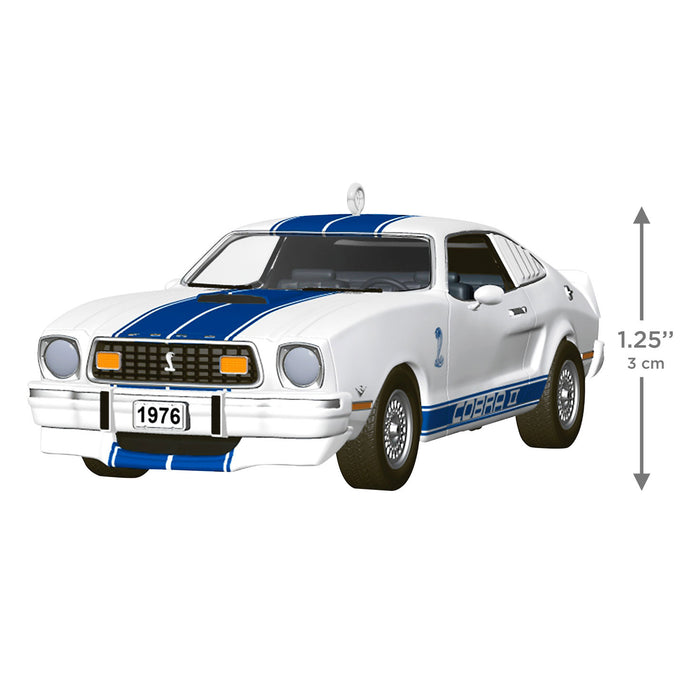 Model car of a 1976 Ford Mustang with blue stripes on a white background