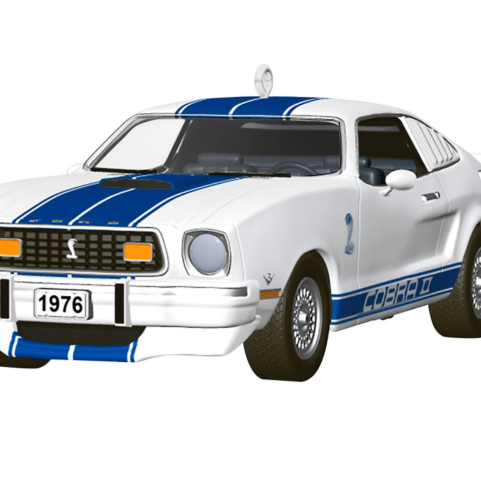 White car with blue stripes and '1976' on a white background