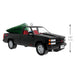 Model of a black truck with a Christmas tree in the bed, on a white background with dimensions indicated.