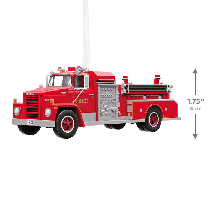 Model of a red fire truck with dimensions indicated on a white background