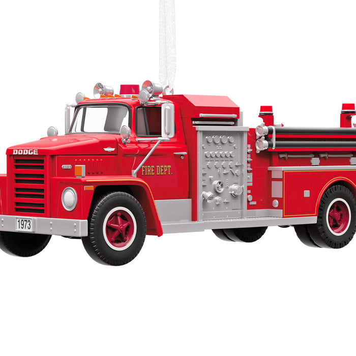 Red fire truck model with 'Fire Dept.' text on a white background