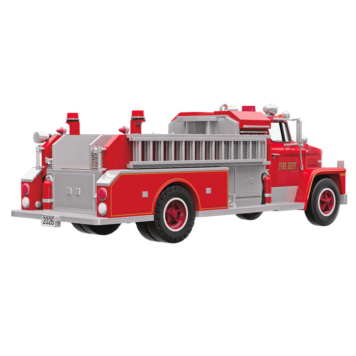 Red toy fire truck on a white background