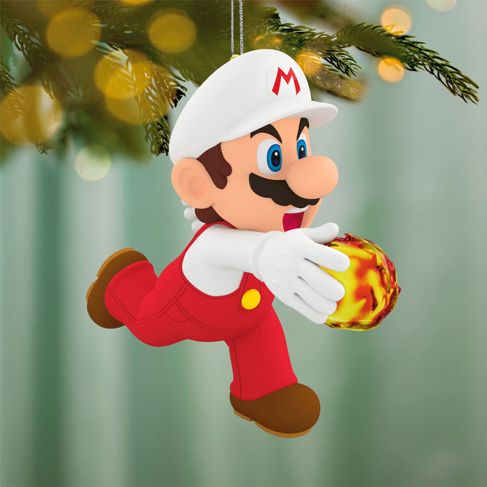 Decorative ornament of a character holding a fireball, hanging from a tree.