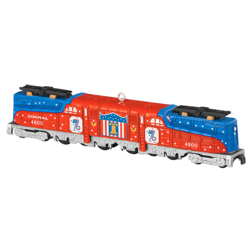 Model train engine with red and blue colors on a white background