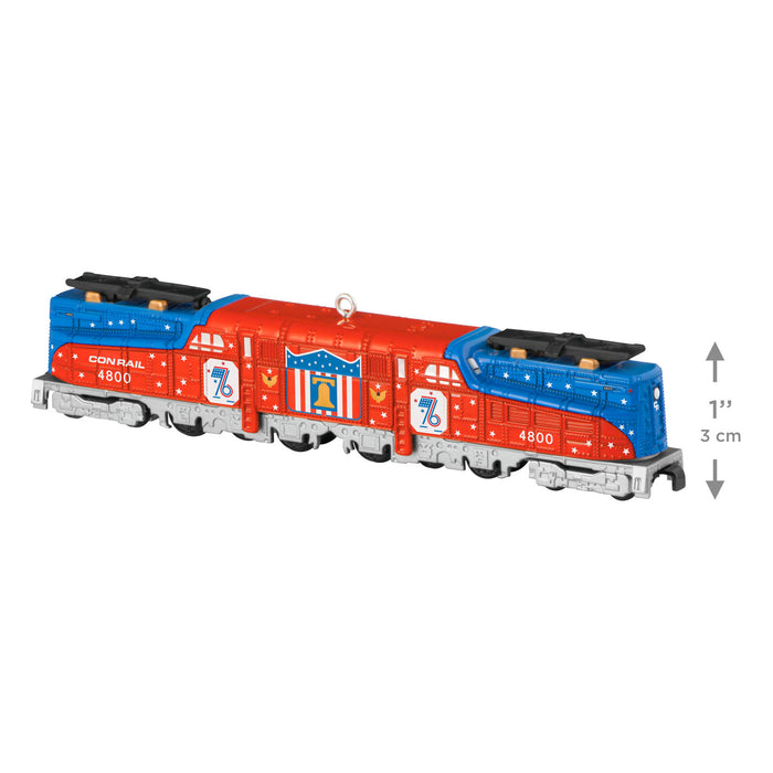 Model train engine with Conrail logo on a white background