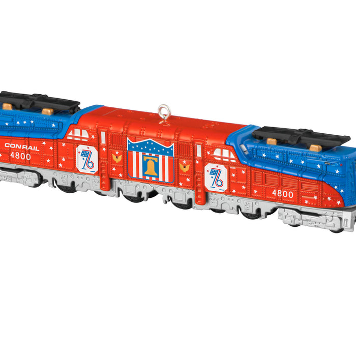 Toy train with red, blue, and white design on a white background
